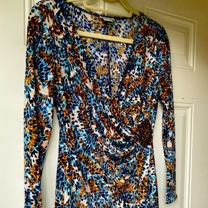 Knit dress,with faux wrap top. Wood clasp.